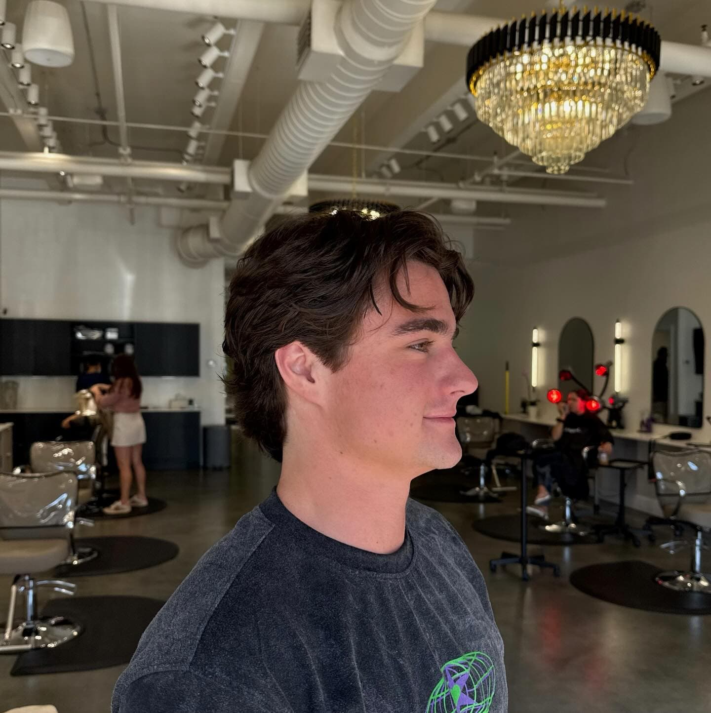 Men's haircut — textured flow on brown medium hair at Volume Hair Salon & Foil Bar in Ponte Vedra Beach, Jacksonville